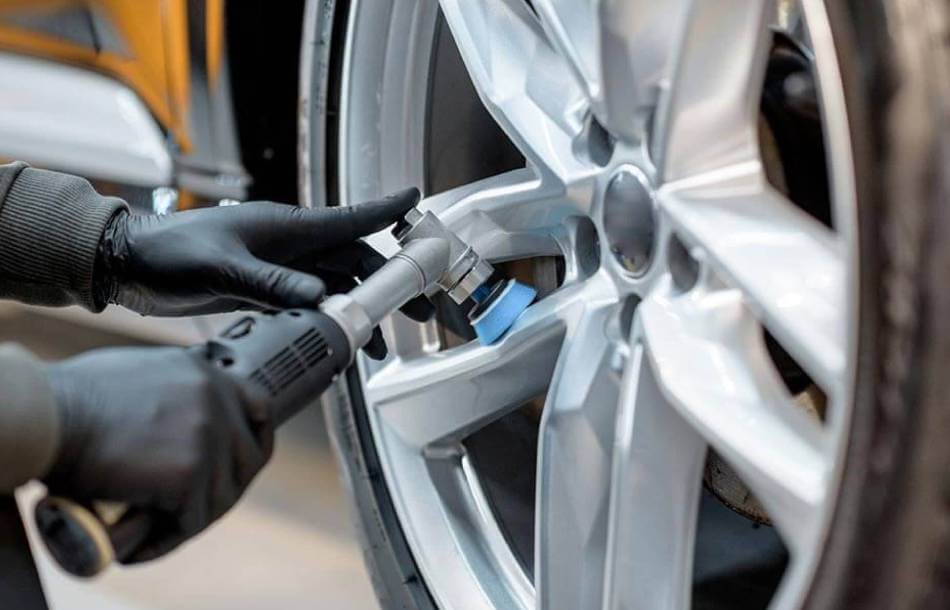 Wheel repair application performed on silver wheel side view